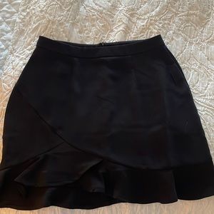 Mini ruffle black silk skirt